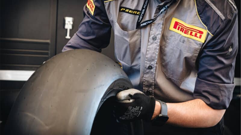 A Pirelli fitter prepares a rear slick during last September’s initial Pirelli MotoGP test at Misano